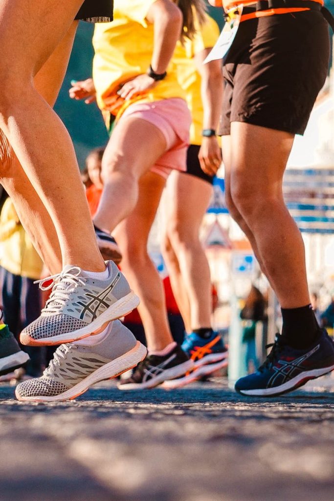 Group of runners participating in a city marathon during daylight.